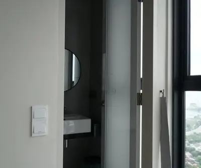 a bathroom with a sink and a mirror at Sky High Stuning Penang Bridge & City Views 3BR in Jelutong