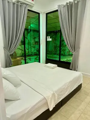 a bed in a room with a large window at Ardour Lodge 