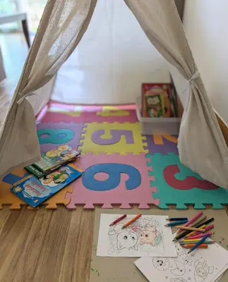 aessori floor with aessori rug with drawings and toys at The Retreat Mountain & Sunrise view Hilltop Hotel Apartment in Cameron Highlands in Cameron Highlands