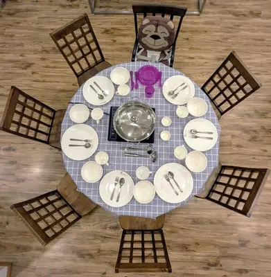 an overhead view of a table with plates and utensils at The Retreat Mountain & Sunrise view Hilltop Hotel Apartment in Cameron Highlands in Cameron Highlands