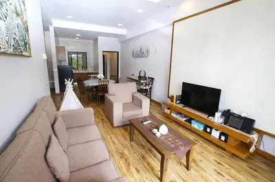 a living room with a couch and a tv at The Retreat Mountain & Sunrise view Hilltop Hotel Apartment in Cameron Highlands in Cameron Highlands