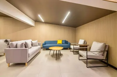 a room with a couch and chairs and a table at Marc CoLiving by Cobytat in Bukit Mertajam