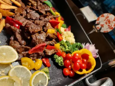 a plate of food with meat and vegetables at The Light Hotel Penang in Perai