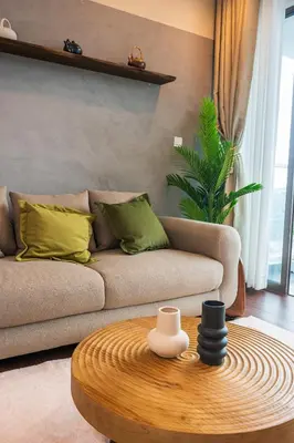 a living room with a couch and a table at Serene Zen Family Retreat 2 to 7pax&Sunrise View in Brinchang