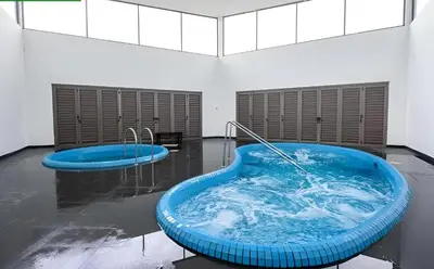 a large blue bath tub in a room at Serene Zen Family Retreat 2 to 7pax&Sunrise View in Brinchang