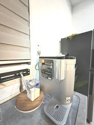 a coffee machine sitting on a counter in a kitchen at Homestay Last World Tambun in Kampong Batu Lapan