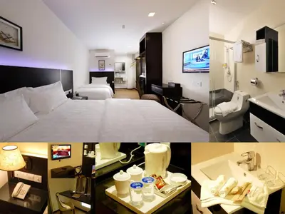 a hotel room with a bed and a bathroom at ERNES Hotel Bandar Perda in Kampong Permatang Batu