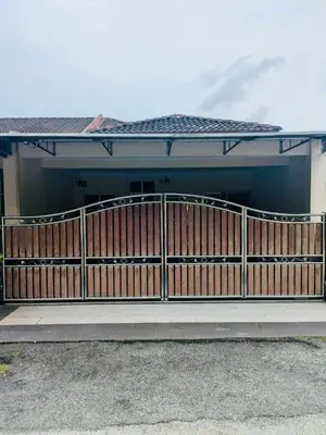a house with a wooden fence in front of it at Seri Changkat Homestay in Kampong Changkat Raja