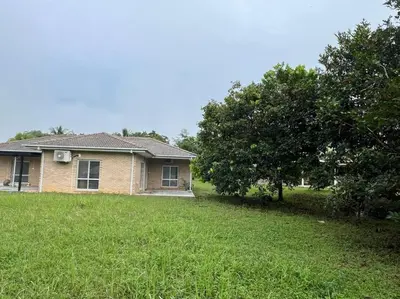 a house in a yard with a grass field at Orchard Lake House - Entire bungalow, 4 rooms, 9 beds, 13 persons in Behrang Hulu