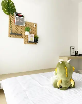 a stuffed animal sitting on top of a bed at Cozy 1Bedroom- 26th- Gurney - Mansion One in George Town