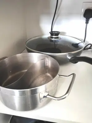 two pans sitting on top of a counter at Cozy 1Bedroom- 26th- Gurney - Mansion One in George Town
