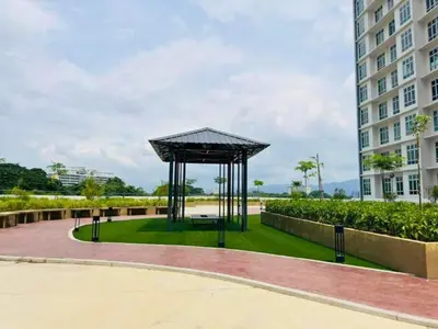 a gazebo in a park next to a building at Anderson Heritage Suites - Ipoh in Ipoh
