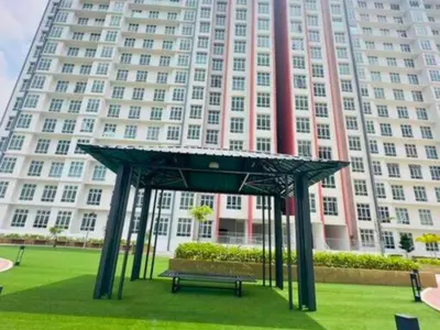 a bench in front of a large building at Anderson Heritage Suites - Ipoh in Ipoh