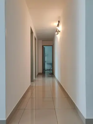 an empty hallway with white walls and tile floors at Seaview Vacation Condo 3R3B 8Pax in Kampong Batu Maung