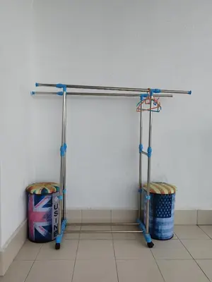 a towel rack in a room with two trash cans at Seaview Vacation Condo 3R3B 8Pax in Kampong Batu Maung