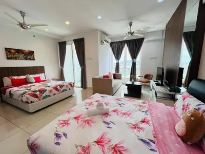 a bedroom with two beds and a living room at Mansion One l 4pax Studio l MountainView & CityView l Gleneagles l by PerfectSweetHome in George Town