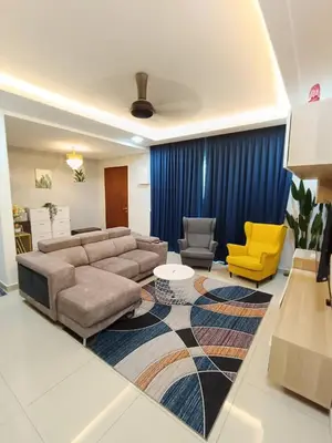 a living room with a couch and two chairs at Harmoni Citra Guesthouse Bertam in Kampong Sungai Korok