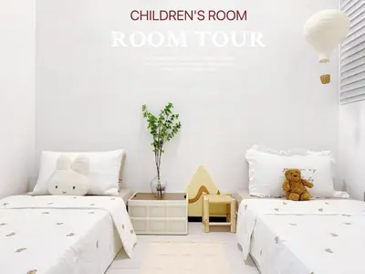 two beds in a childrens room with white walls at Georgetown Childroom Seaview & Cityview Infinity Pool with 2 Carpark in Jelutong