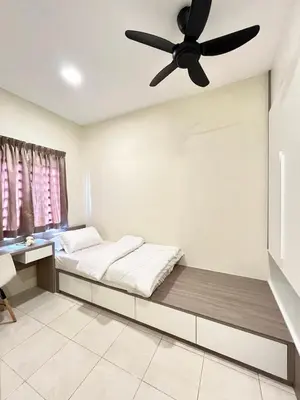 a room with a bed with a ceiling fan at AbelHome in Teluk Intan