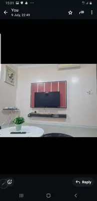 a screen shot of a living room with a tv at Crystal Creek Taiping in Taiping
