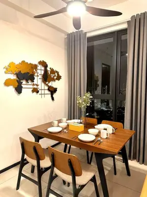 a dining room table with chairs and a ceiling fan at Urban Seaview with Infinity Pool, Luxury Modern Stylish 7pax 3Bedroom 3Queen in Jelutong