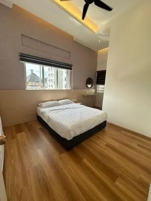 a large bedroom with a bed and a window at Adik aisyah Cameron Black Pink in Tanah Rata
