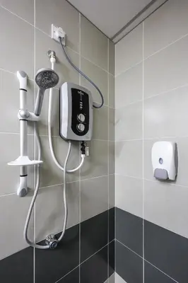 a shower in a bathroom with a hair dryer at Minion Escap Family Homestay in Brinchang Cameron Highland Clover Home 9-25 in Brinchang