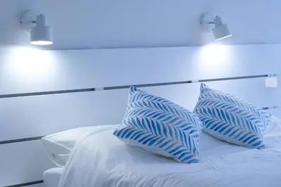 two blue pillows sitting on top of a bed at Tung's Hideout- Centrum Cameron in Brinchang