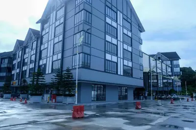 a large building with orange cones in a parking lot at Tung's Hideout- Centrum Cameron in Brinchang