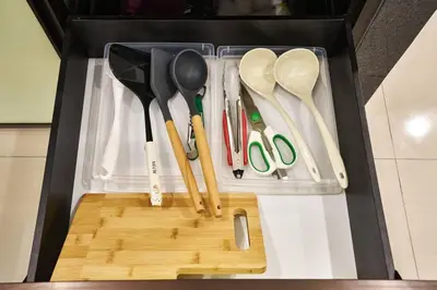 a drawer full of kitchen utensils in a refrigerator at Ipoh South Homestay 8-16pax 10mins to attraction in Ipoh