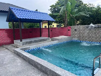 a swimming pool with a gazebo in a backyard at D'Nuha homestay Unit 2 Chenderong Balai Teluk Intan in Kampung Degong