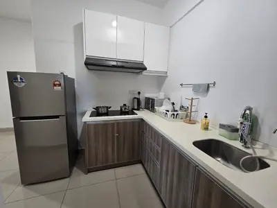 a kitchen with a stainless steel refrigerator and a sink at Majestic The Imperial Tower - Ipoh in Ipoh