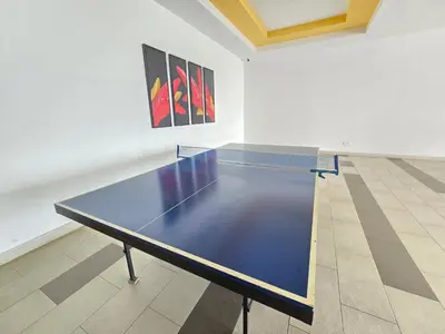 a ping pong table in an empty room with at Majestic The Imperial Tower - Ipoh in Ipoh