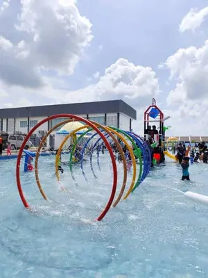 a water park with a water slide in the water at CozyStayz Perak in Sitiawan