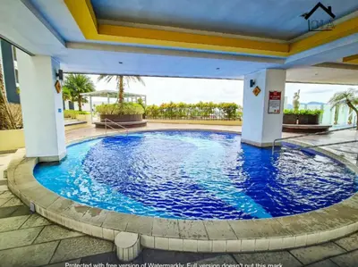 a large pool with blue water in a building at Ipoh Majestic 2 Bedrooms 4Pax Modern Apartment by City Home Empire in Ipoh