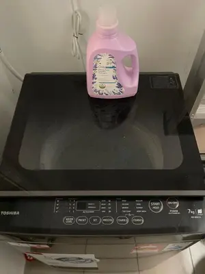 a baby bottle sitting on top of a microwave at JS Ipoh Homestay 2 At The Majestic Ipoh in Ipoh