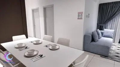 a white dining room with a white table and a blue chair at The Horizon Ipoh by 40 Winks in Ipoh