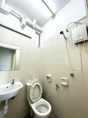 a bathroom with a toilet and a sink and a shower at Tur -Weeks Stay-3rooms Private House in Bayan Lepas