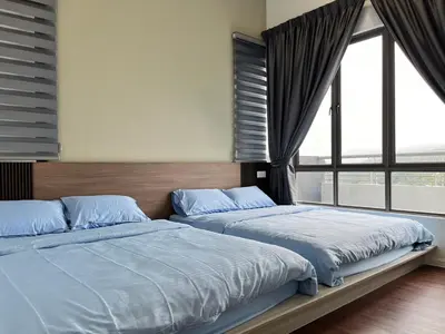 two beds in a bedroom with a large window at FY Friends at Emerald Avenue Brinchang in Tanah Rata