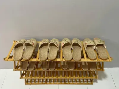 a row of shoes sitting on a shelf at Space of Tranquility Quintet in Tanah Rata
