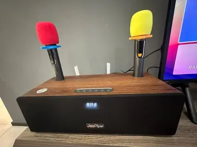 two lipsticksticks sitting on top of a gaming system at Perfect KTV Set & Netflix 3 Queen Bed Seaview in Jelutong