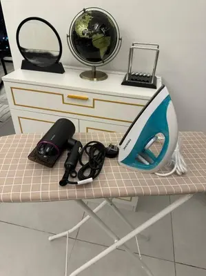 a table with a desk with a computer on it at Perfect KTV Set & Netflix 3 Queen Bed Seaview in Jelutong