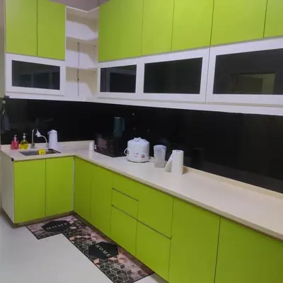 a green and white kitchen with green cabinets at WeJDAN TWO POINT O WHOLE HOUSE BUT BUDGET PARTIAL BOOKING 2ROOMS 2BATHROOMS AND NEVER MIX WITH OTHERS AND YOUR TEAM ONLY BALIK PULAU, PENANG ISLAND in Balik Pulau