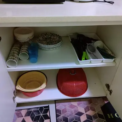 a cupboard with plates and bowls and other dishes at WeJDAN TWO POINT O WHOLE HOUSE BUT BUDGET PARTIAL BOOKING 2ROOMS 2BATHROOMS AND NEVER MIX WITH OTHERS AND YOUR TEAM ONLY BALIK PULAU, PENANG ISLAND in Balik Pulau