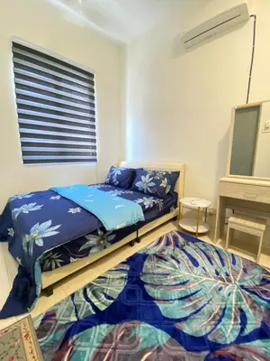 a bedroom with two beds and a piano at Deandra Homestay- WiFi-Aircond-Dryer in Sungai Petani