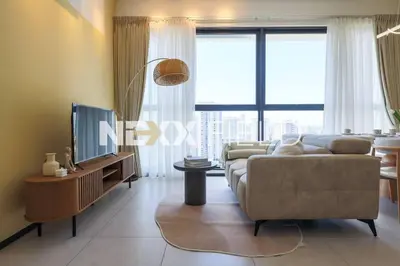 a living room with a couch and a tv at Urban Suites Penang by Nexx Field in Jelutong