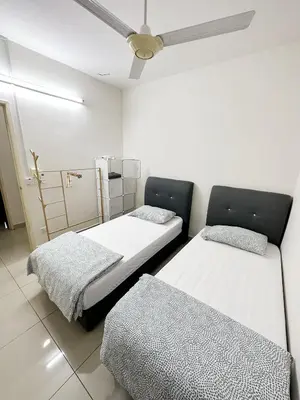a room with two beds and a ceiling fan at TuR05-Pisa Stadium-3room-Private in Bayan Lepas
