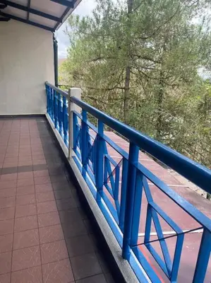 a blue railing on a balcony of a building at Brinchang Cameron 2R2B 10 paxs KeaFarm #14402 in Brinchang