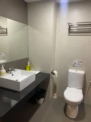 a bathroom with a white toilet and a sink at Brinchang Cameron 2R2B 10 paxs KeaFarm #14402 in Brinchang