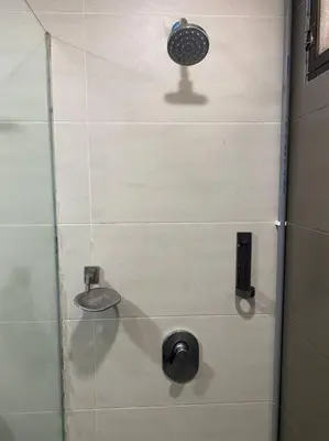 a shower stall with a shower head and a sink at Brinchang Cameron 2R2B 10 paxs KeaFarm #14402 in Brinchang